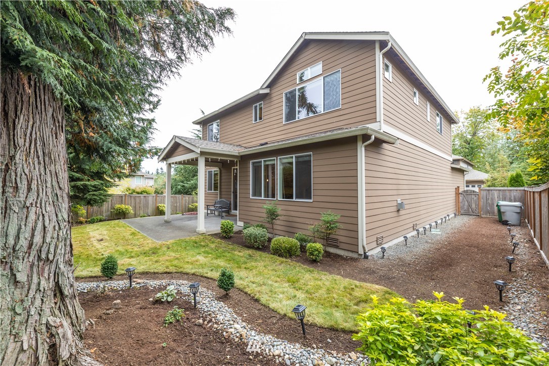 6117 Northeast 1st Street Renton, WA 98059 - Photo 33 of 39 a view of a house with backyard and sitting area
