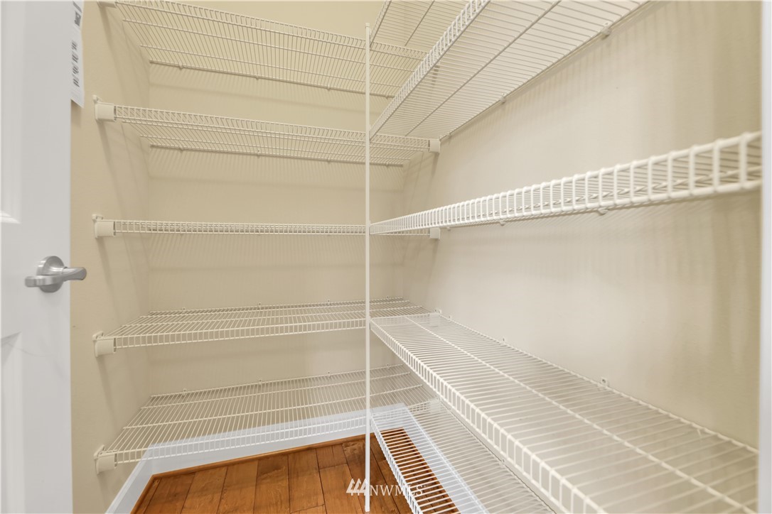 6117 Northeast 1st Street Renton, WA 98059 - Photo 6 of 39 a view of a room with racks on the wall