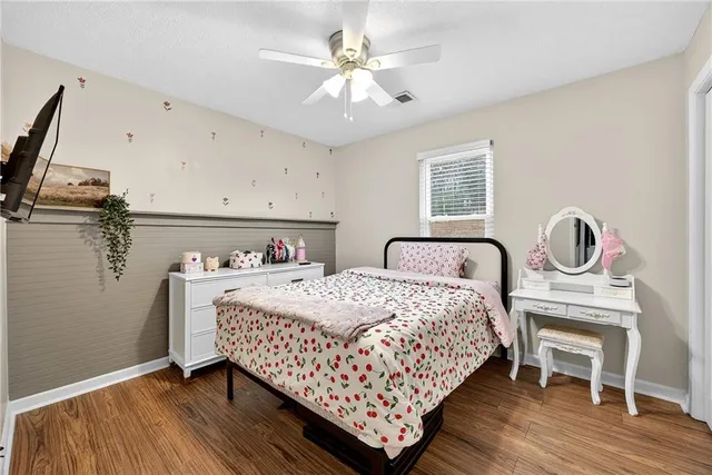a bedroom with a bed and a table