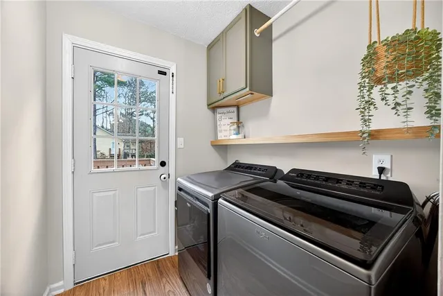 a kitchen with a stove microwave and cabinets