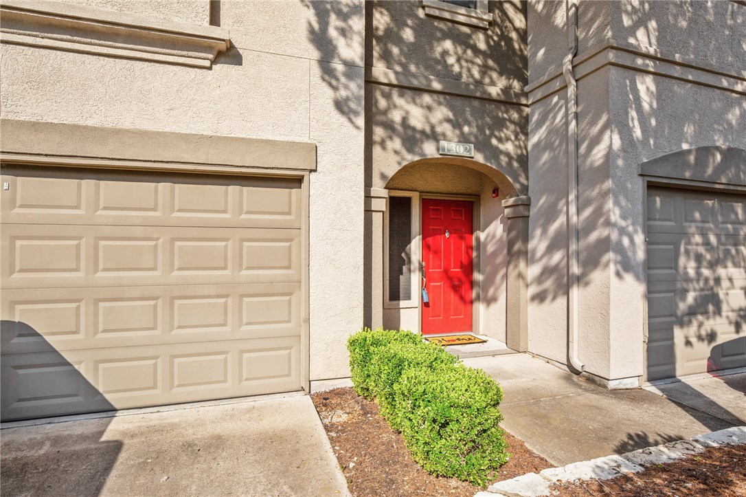 a front view of a house with a garage