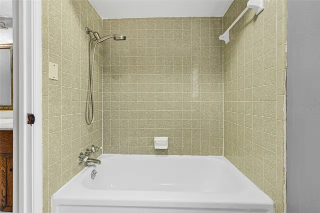 a bathroom with a white bath tub