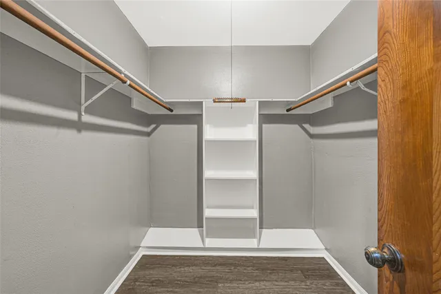 a view of an empty walk in closet