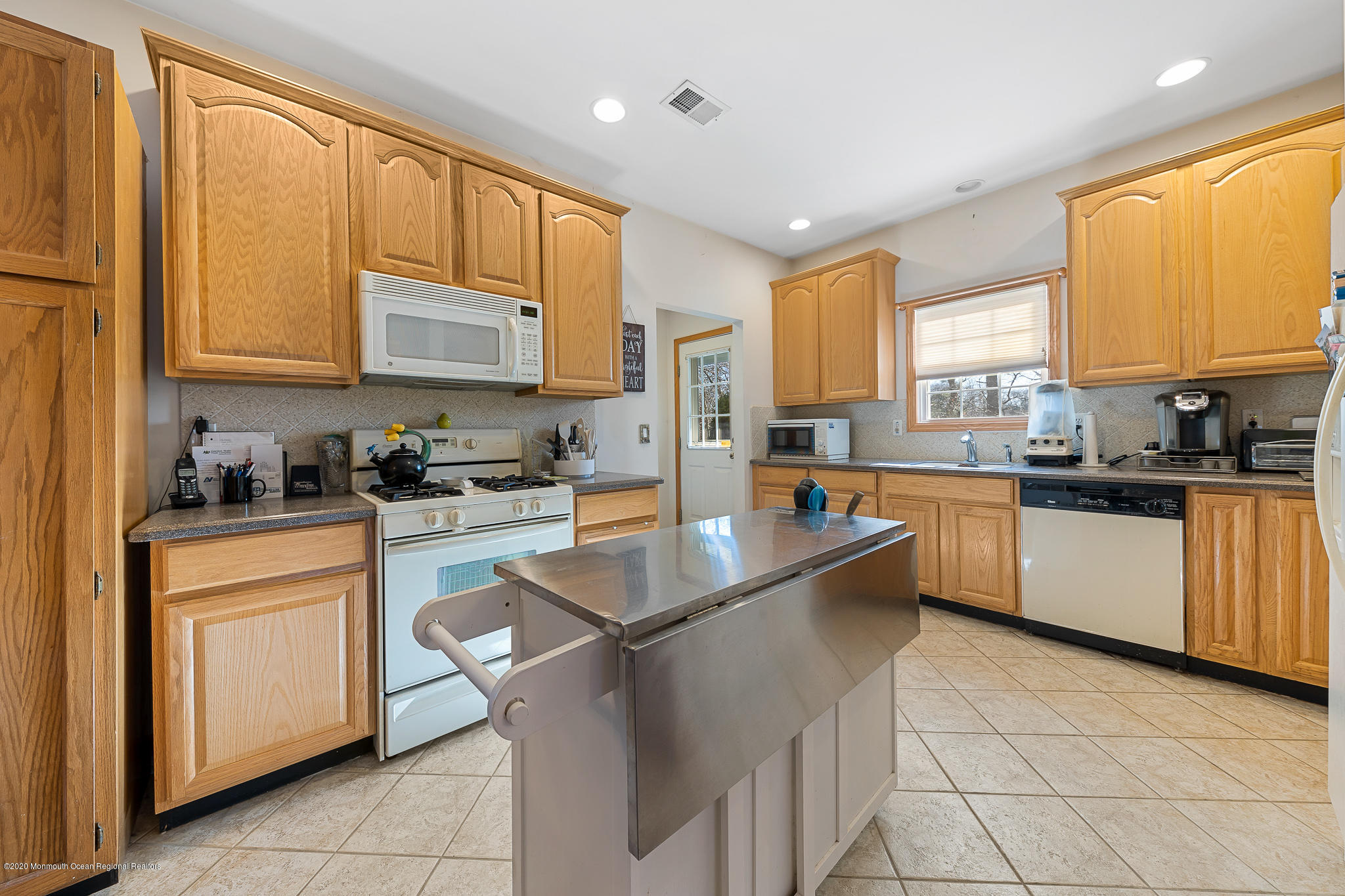 291 Frank Applegate Road Jackson, NJ 08527 - Photo 11 of 38 a kitchen with stainless steel appliances granite countertop a sink a stove and cabinets