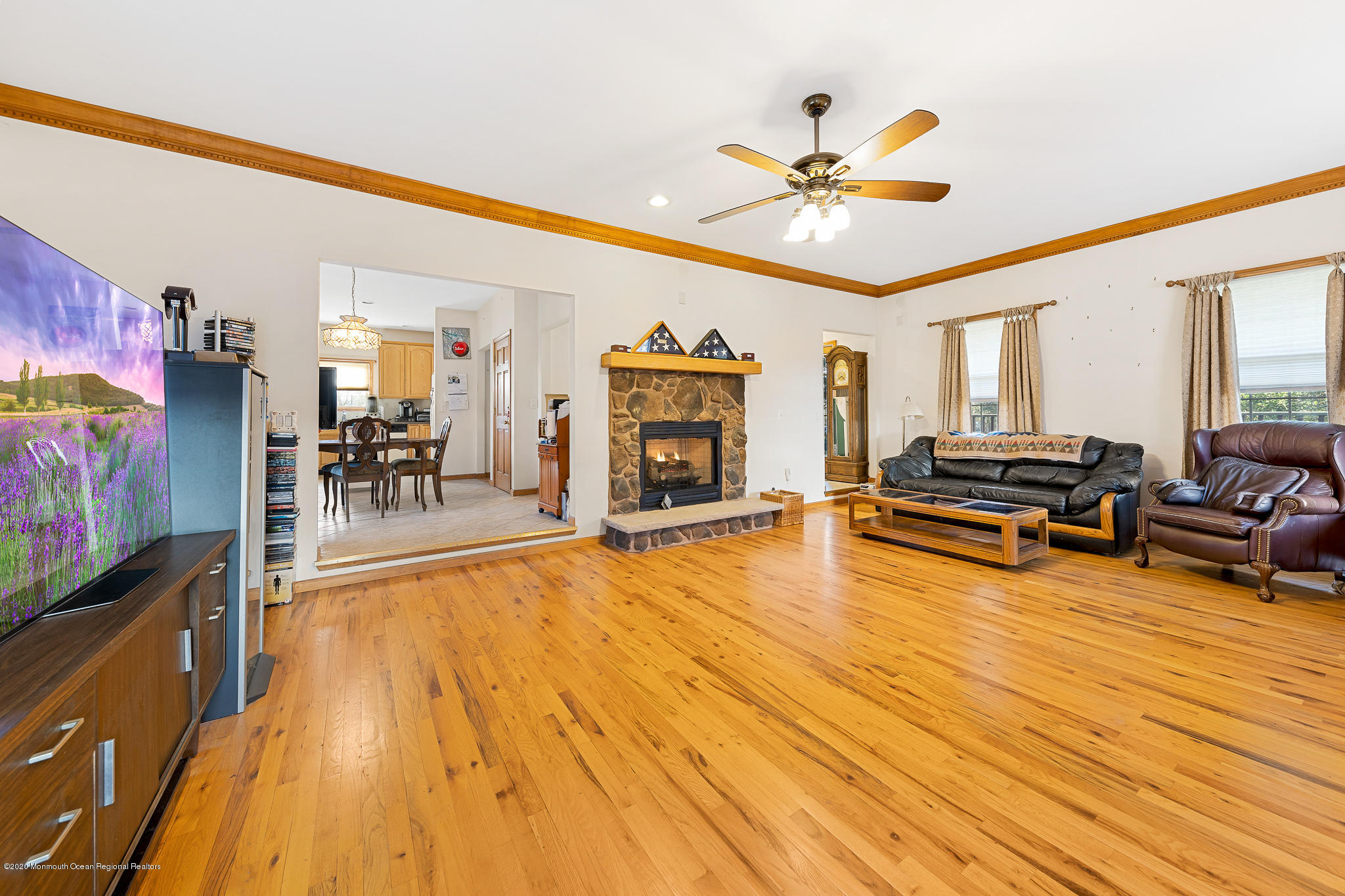 291 Frank Applegate Road Jackson, NJ 08527 - Photo 19 of 38 a living room with furniture and a flat screen tv with kitchen view