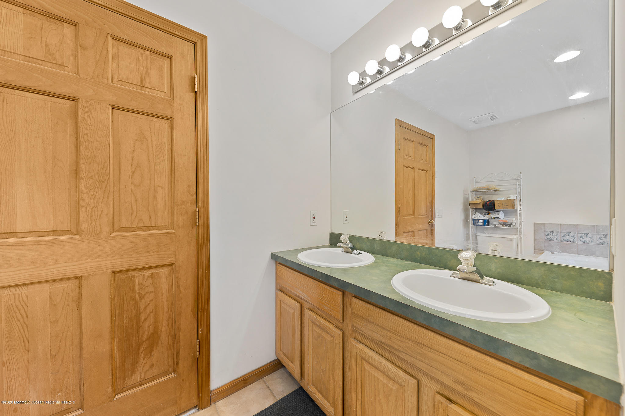 291 Frank Applegate Road Jackson, NJ 08527 - Photo 24 of 38 a bathroom with a sink and a mirror