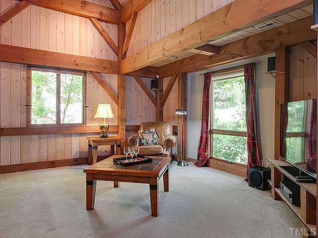 809 Berwyn Way Raleigh, NC 27615 - Photo 7 of 25 Large living room with Vaulted Ceilings. You must sit in this chair and look up. Spectacular view of home!!! Living Room