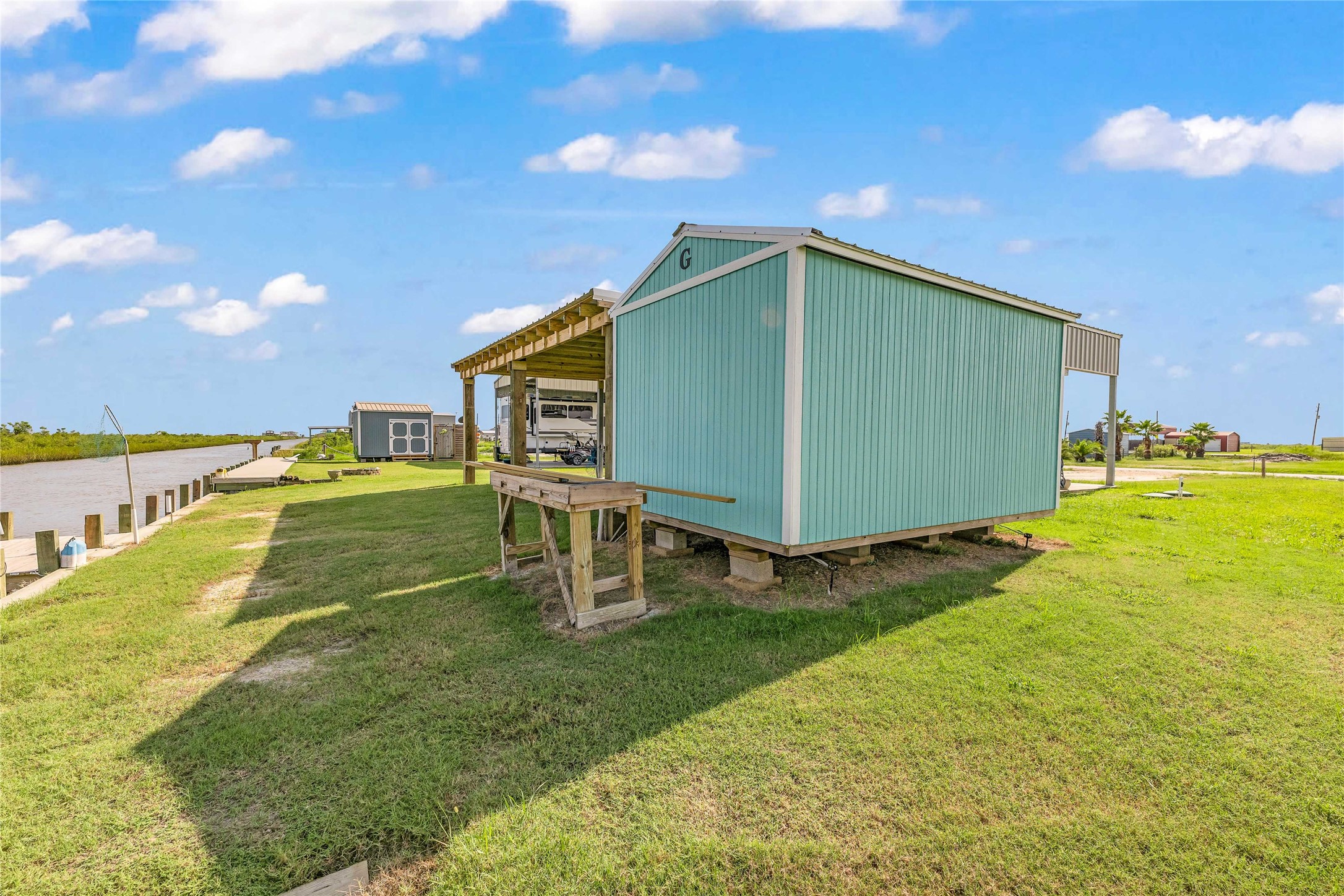 1306 Mabry Port Bolivar, TX 77650 - Photo 11 of 22 a view of a backyard with a garden