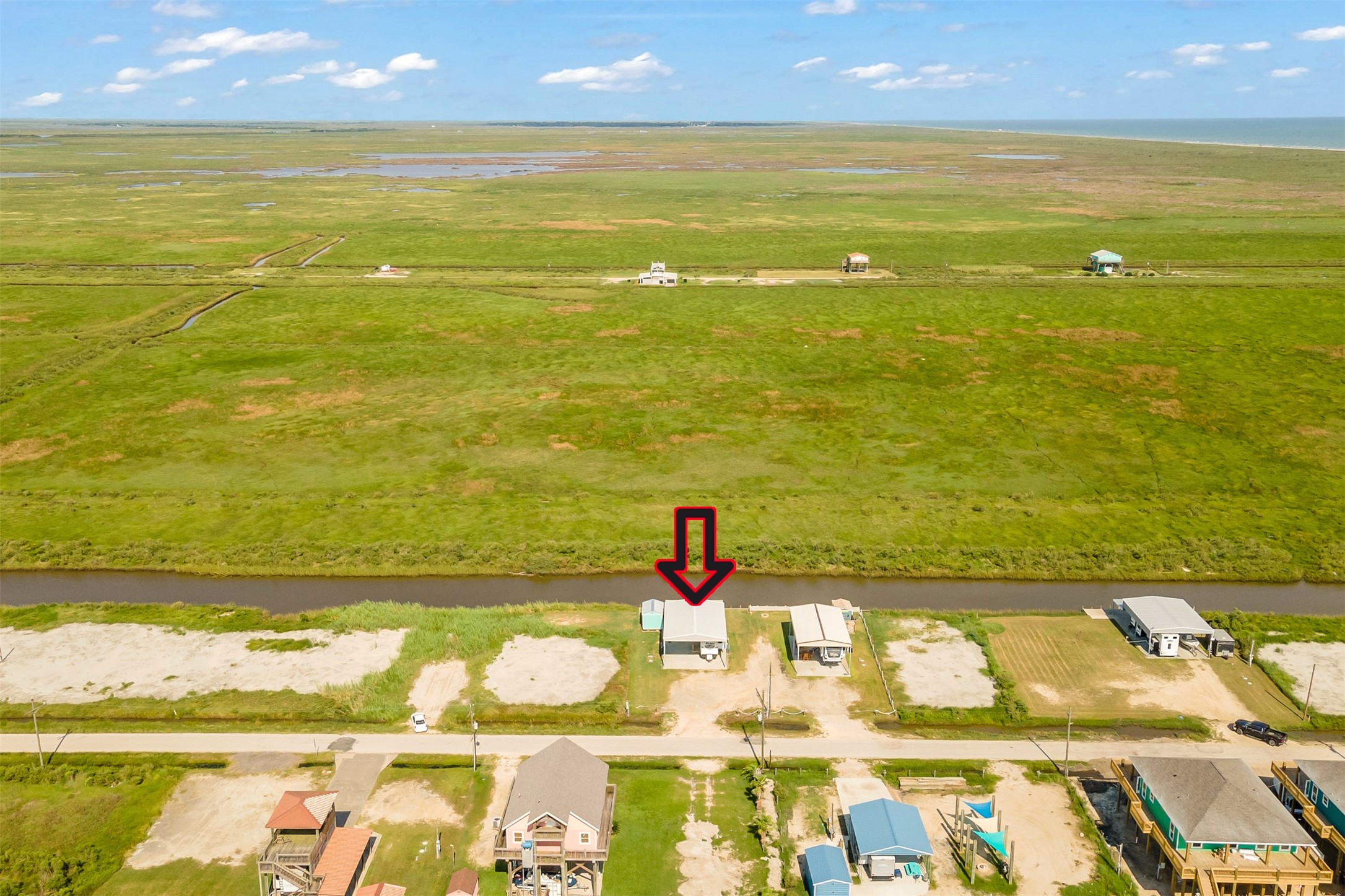 1306 Mabry Port Bolivar, TX 77650 - Photo 14 of 22 a view of an ocean and a nearby beach