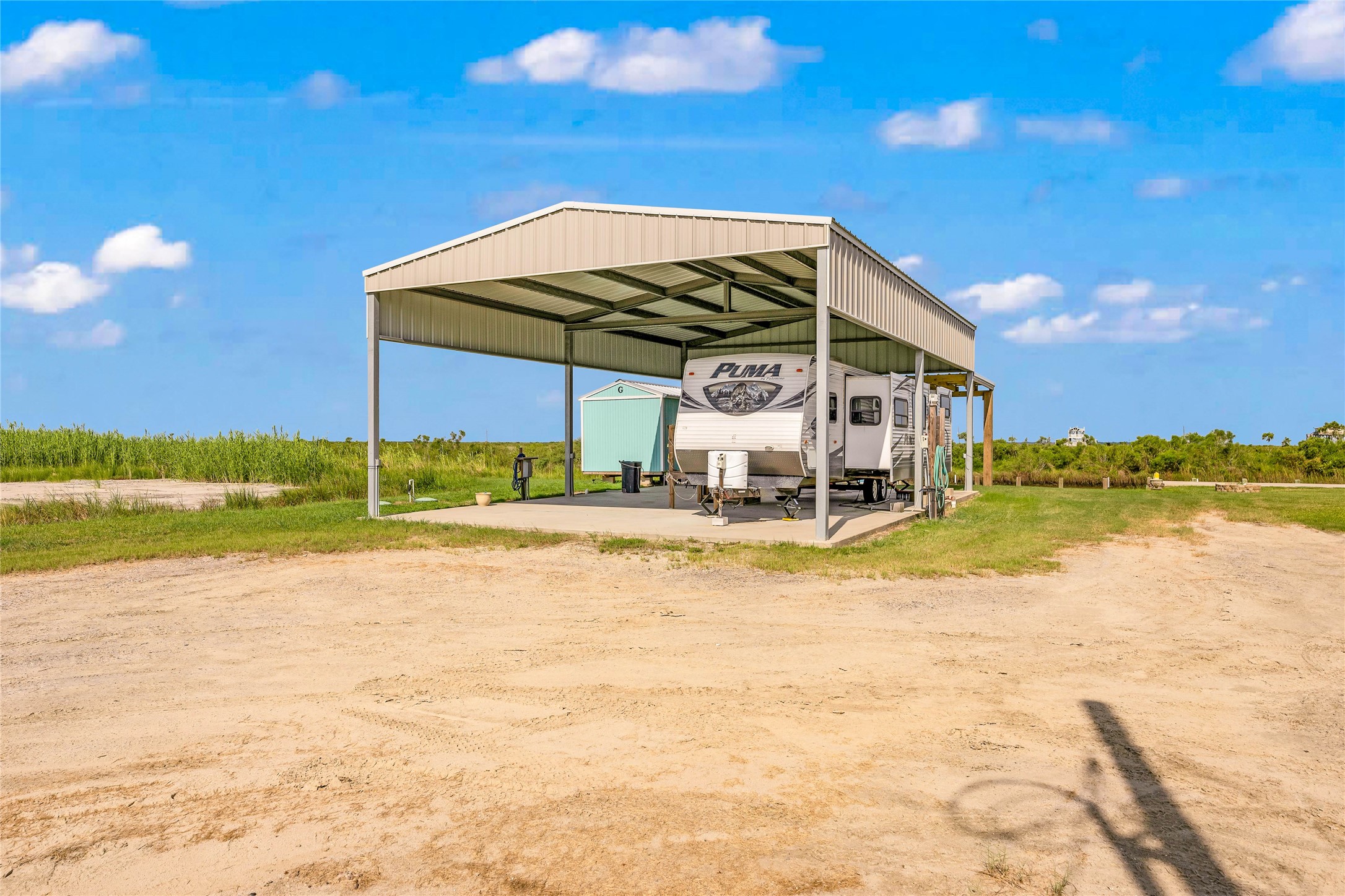 1306 Mabry Port Bolivar, TX 77650 - Photo 8 of 22 a view of a swimming pool with an outdoor space and seating area