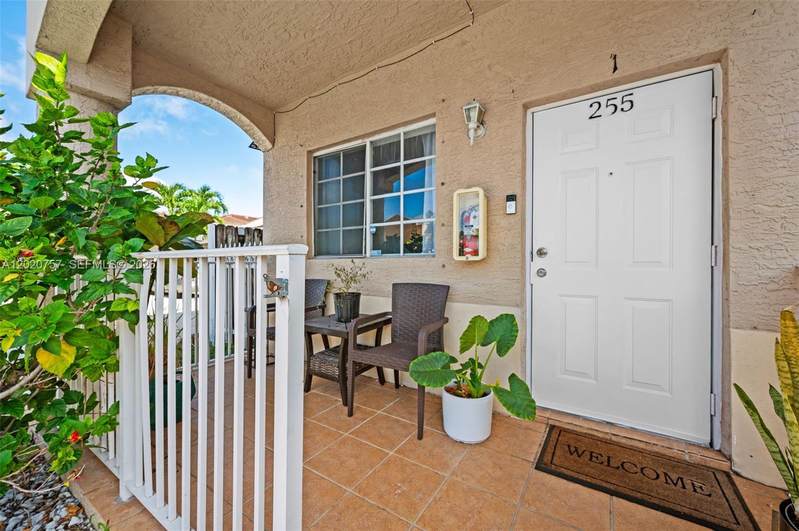 255 East 3rd Street, Unit 1 Hialeah, FL 33010 - Photo 3 of 38 a view of a balcony with chairs and a potted plant