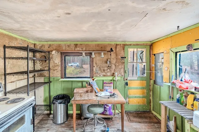 a workspace with furniture hardwood and a window