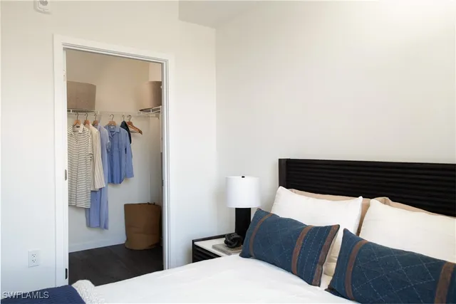 a living room with furniture and a mirror