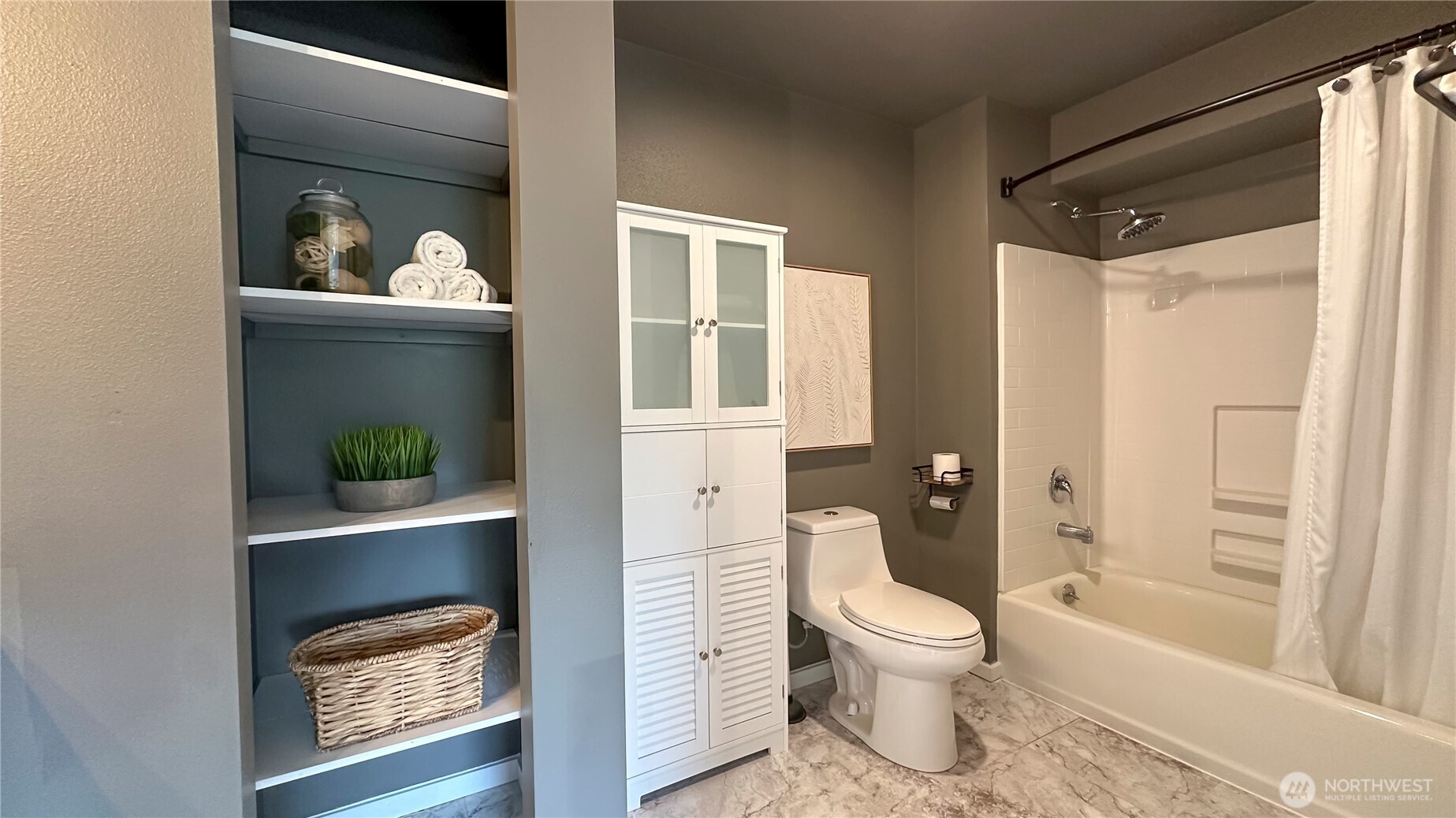 912 Northeast 115th Street Seattle, WA 98125 - Photo 15 of 21 a bathroom with a toilet and a shower