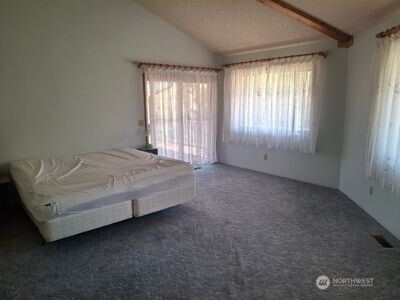 37896 Snake River Road Asotin, WA 99402 - Photo 12 of 23 a spacious bedroom with a bed and a window