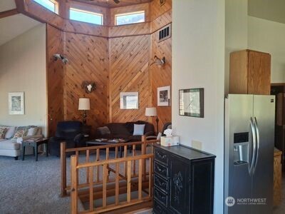 37896 Snake River Road Asotin, WA 99402 - Photo 20 of 23 a kitchen with stainless steel appliances granite countertop a stove a refrigerator and a dining table