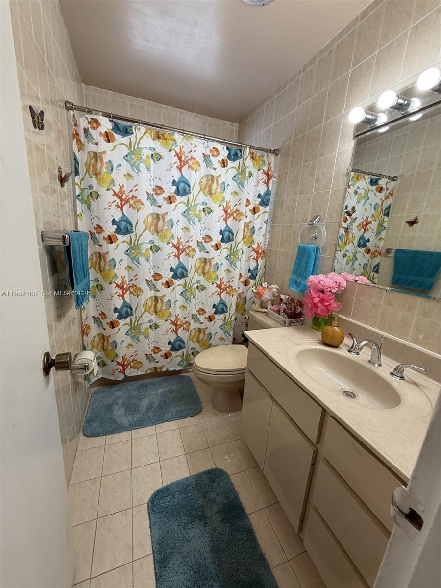 4012 Southwest 102nd Court Miami, FL 33165 - Photo 8 of 10 a bathroom with a sink toilet and shower