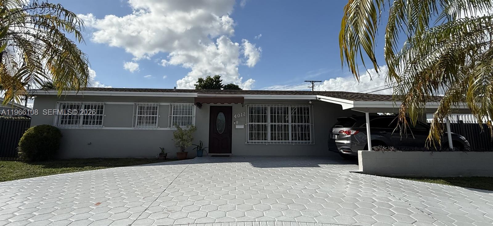 4012 Southwest 102nd Court Miami, FL 33165 - Photo 9 of 10 a view of a house with a backyard