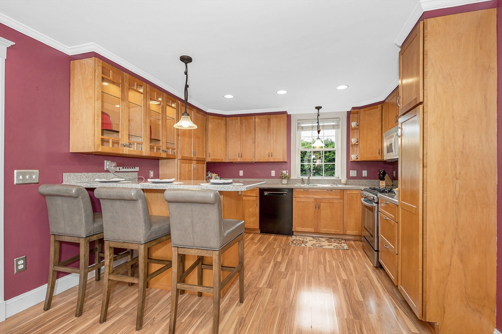 35 Warren Avenue Reading, MA 01867 - Photo 13 of 41 a kitchen with a sink appliances cabinets and furniture