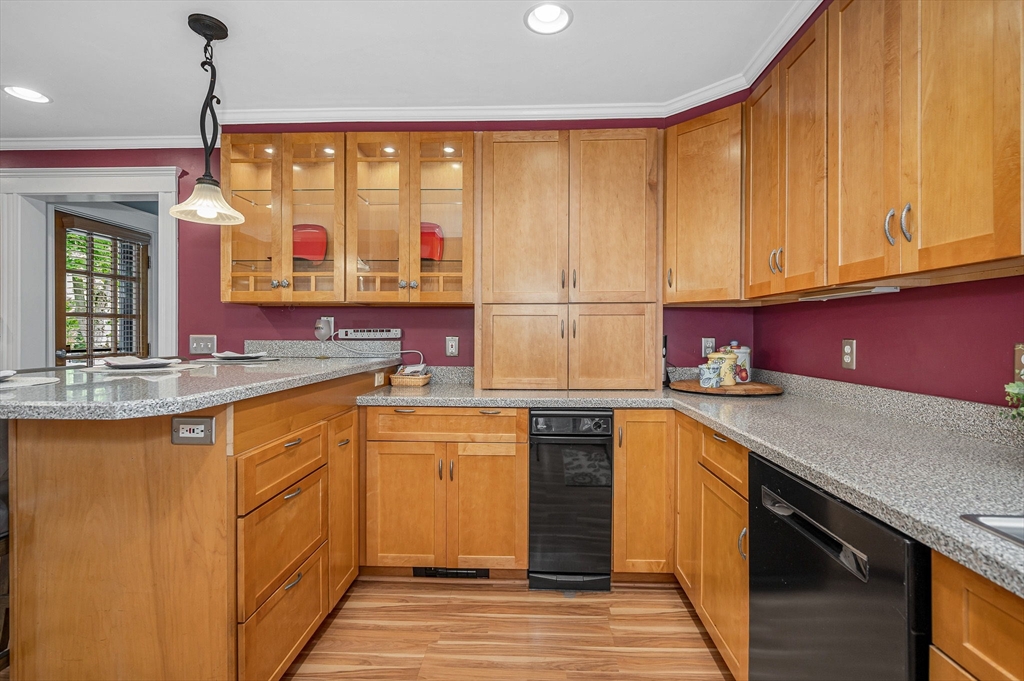 35 Warren Avenue Reading, MA 01867 - Photo 15 of 41 a kitchen with stainless steel appliances granite countertop a sink a stove and a refrigerator