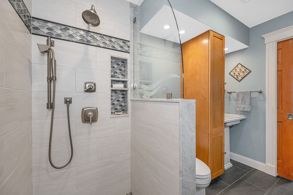 35 Warren Avenue Reading, MA 01867 - Photo 18 of 41 a bathroom with a shower and a sink