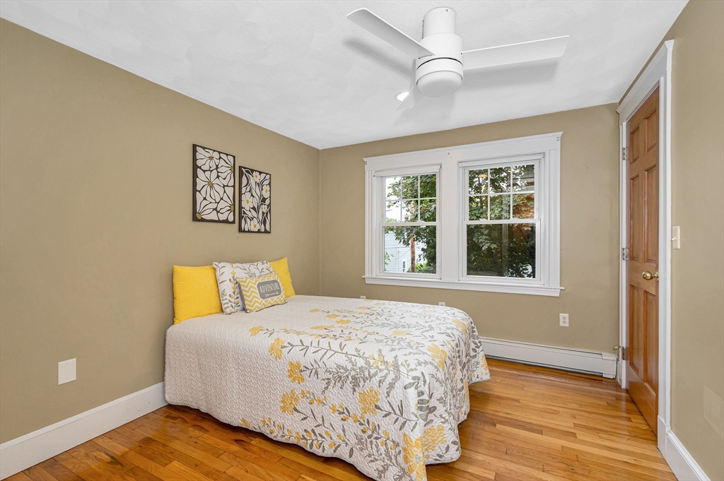 35 Warren Avenue Reading, MA 01867 - Photo 20 of 41 a bedroom with a bed and a window