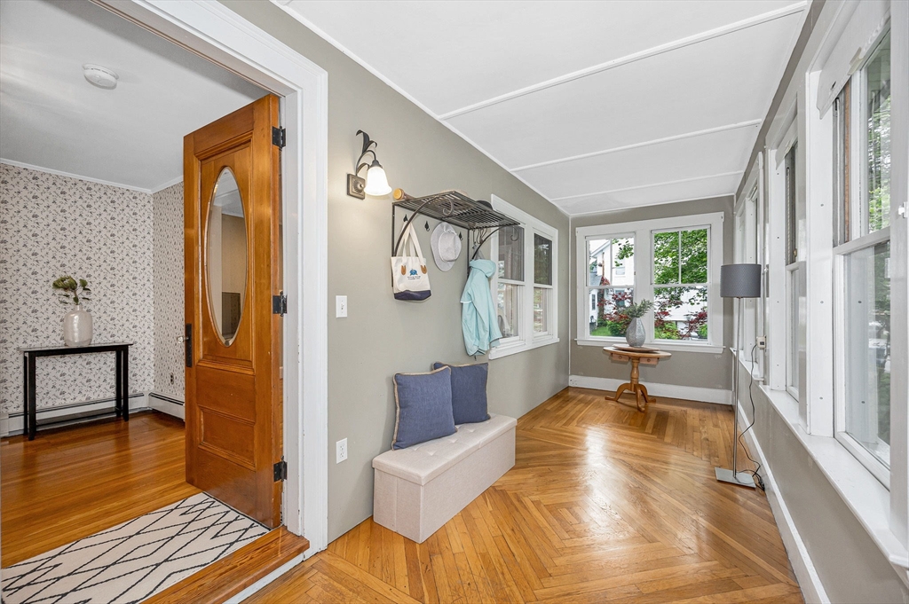 35 Warren Avenue Reading, MA 01867 - Photo 2 of 41 a spacious bedroom with a bed and wooden floor