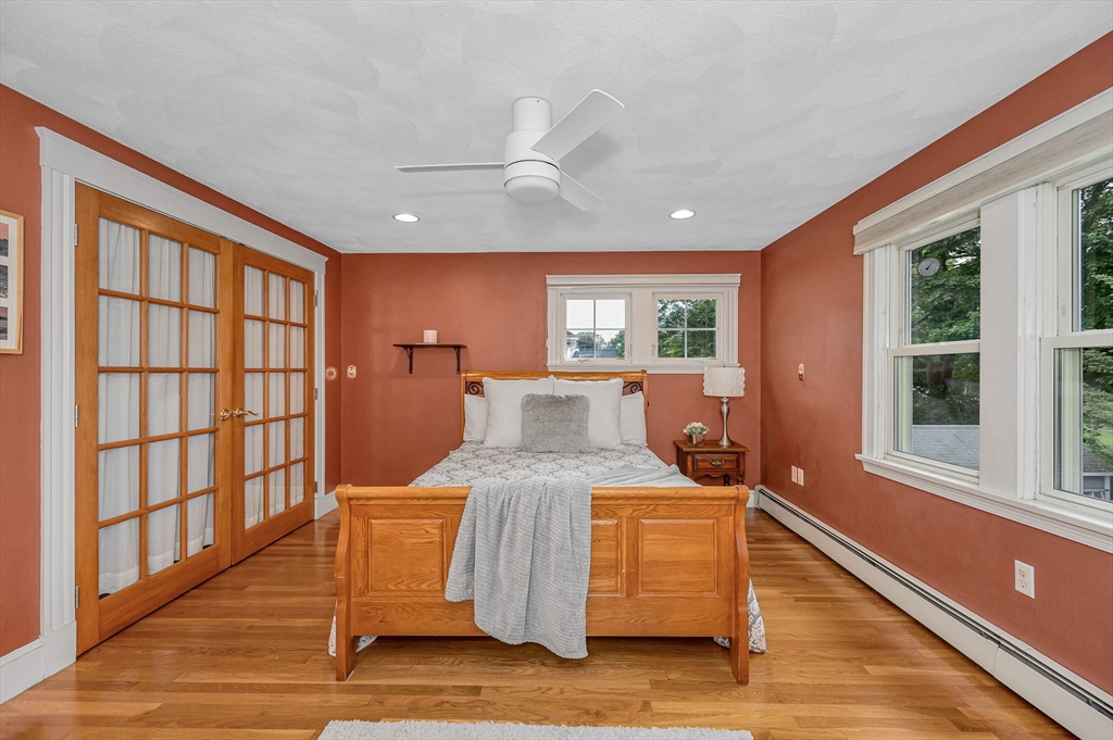 35 Warren Avenue Reading, MA 01867 - Photo 26 of 41 a room with a balcony wooden floor and furniture