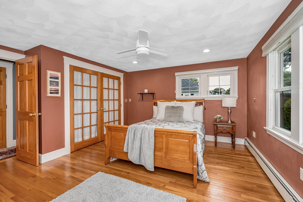 35 Warren Avenue Reading, MA 01867 - Photo 27 of 41 a living room with a balcony furniture and a window