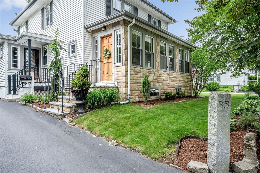 35 Warren Avenue Reading, MA 01867 - Photo 33 of 41 a view of a house with a yard and plants