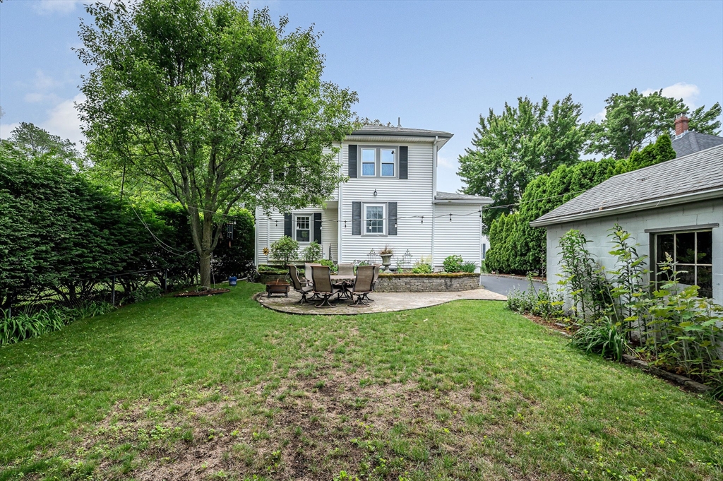 35 Warren Avenue Reading, MA 01867 - Photo 40 of 41 a view of a house with sitting area and garden