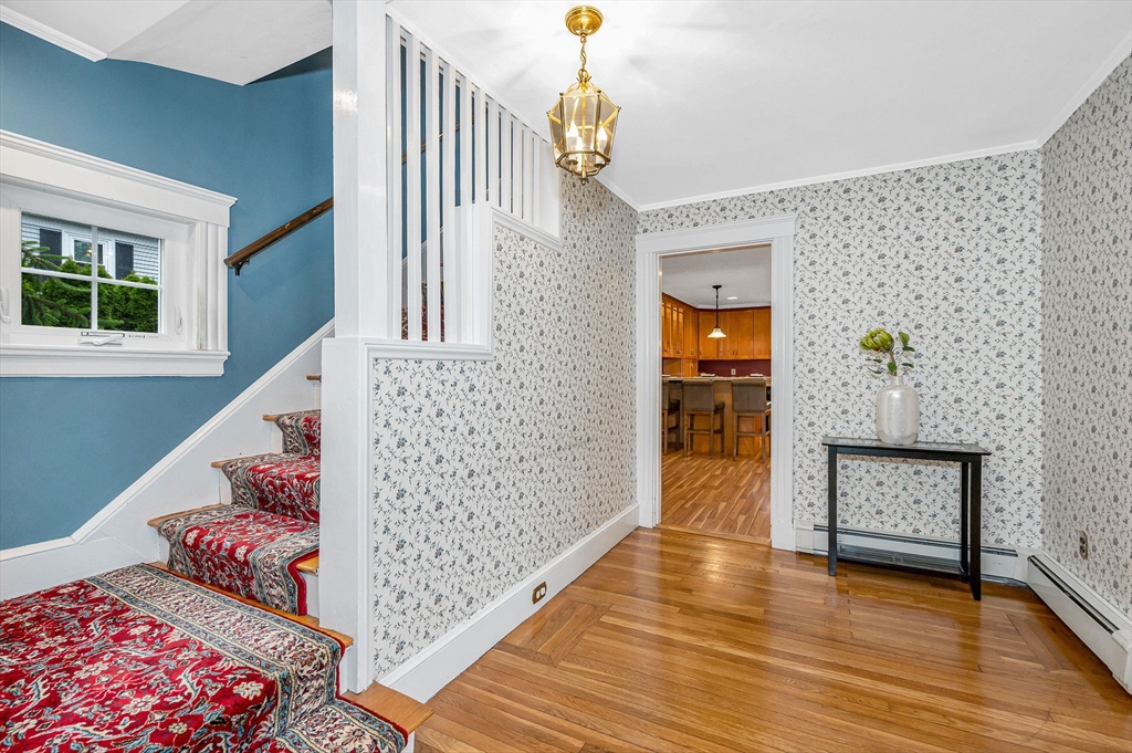 35 Warren Avenue Reading, MA 01867 - Photo 4 of 41 a view of a hallway view with wooden floor and staircase