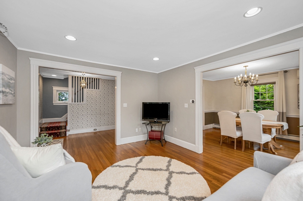 35 Warren Avenue Reading, MA 01867 - Photo 8 of 41 a living room with furniture and a flat screen tv