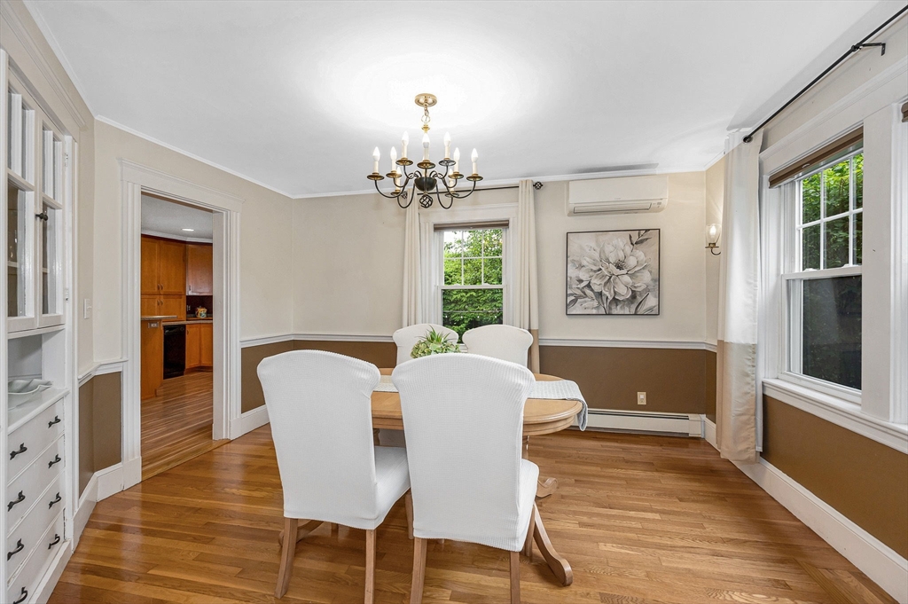 35 Warren Avenue Reading, MA 01867 - Photo 9 of 41 a view of a dining room with furniture a rug and wooden floor