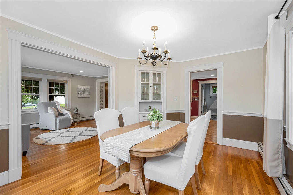 35 Warren Avenue Reading, MA 01867 - Photo 10 of 41 a view of a dining room with furniture window and wooden floor