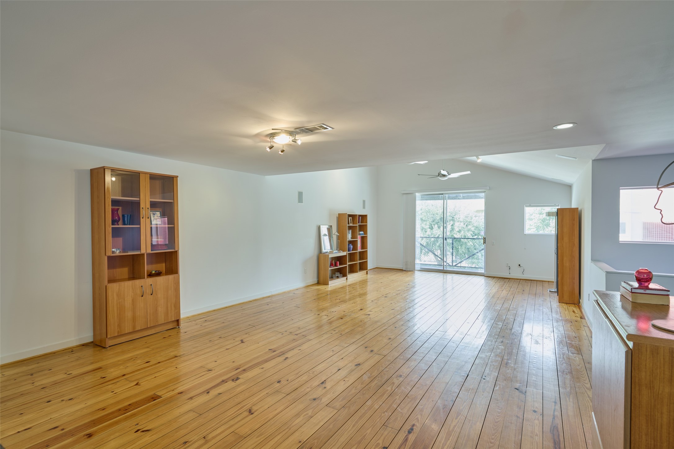 2811 Crawford Street Houston, TX 77004 - Photo 13 of 37 a view of empty room with wooden floor and fan