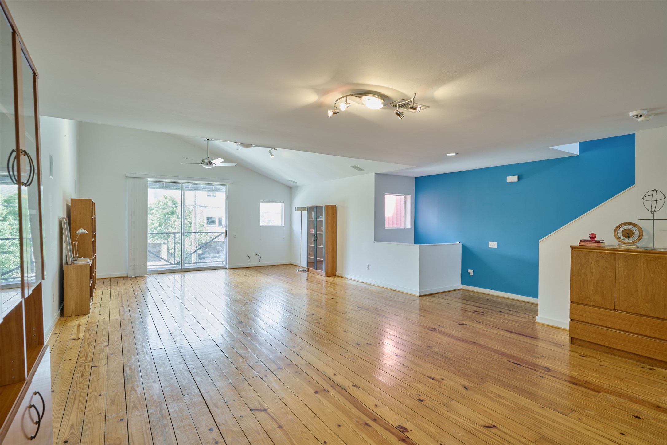 2811 Crawford Street Houston, TX 77004 - Photo 17 of 37 a view of an empty room with wooden floor and a window