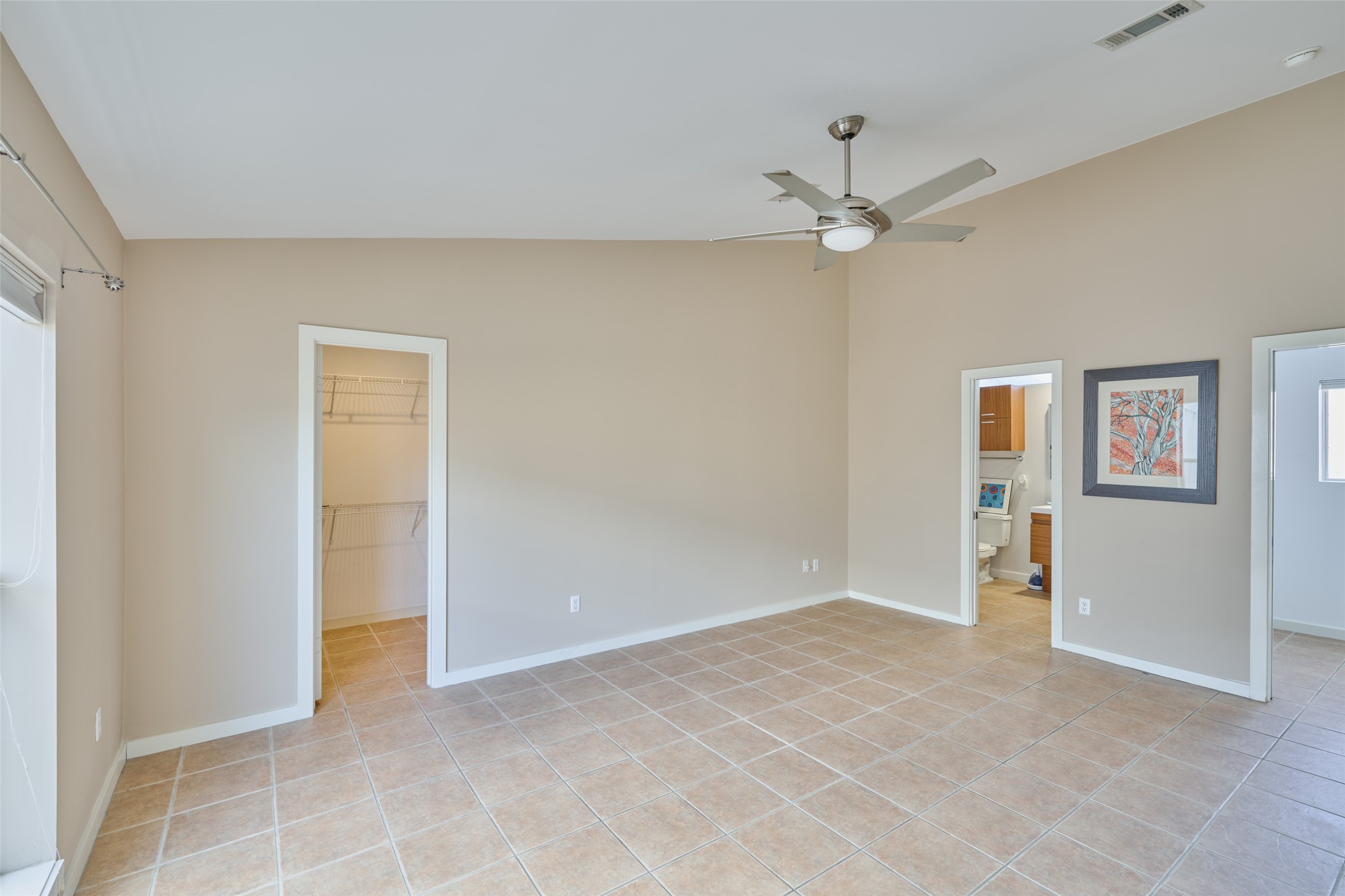 2811 Crawford Street Houston, TX 77004 - Photo 22 of 37 a view of an empty room with a ceiling fan