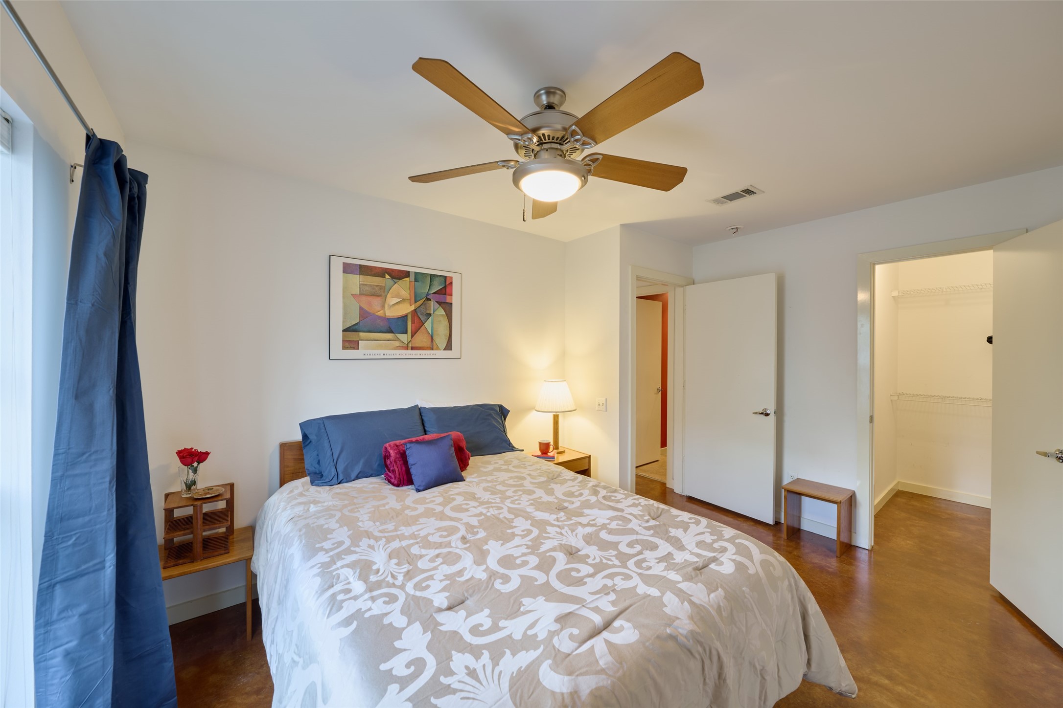 2811 Crawford Street Houston, TX 77004 - Photo 31 of 37 a bedroom with a bed and a chandelier