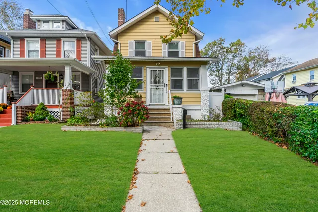 front view of a house and a yard