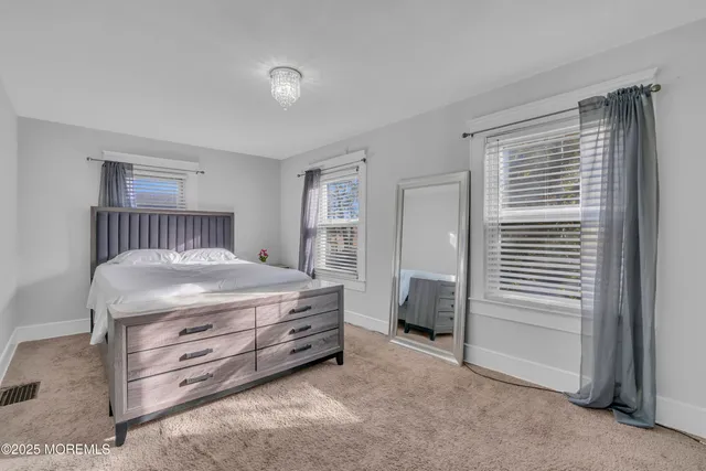 a bedroom with a bed and a cabinets