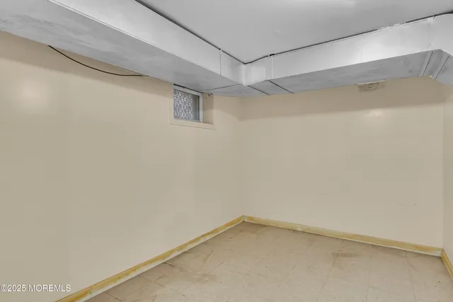 a view of a livingroom with wooden furniture