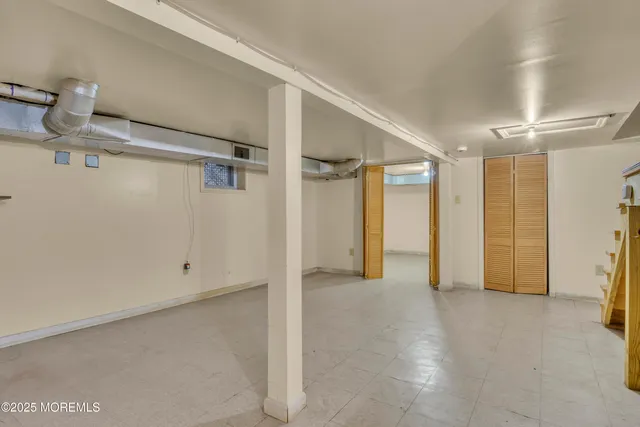 a room with a sink and a mirror