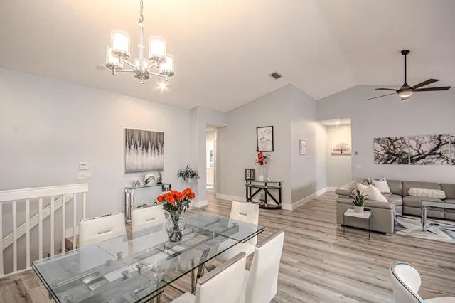a view of a living room and dining room