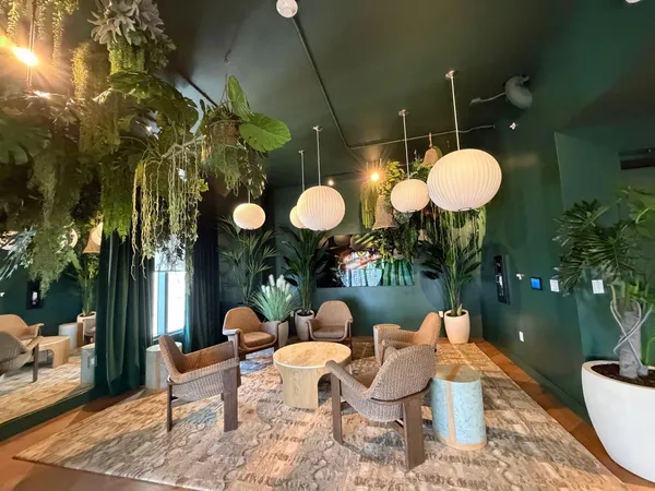a outdoor living space with lots of tables and chairs