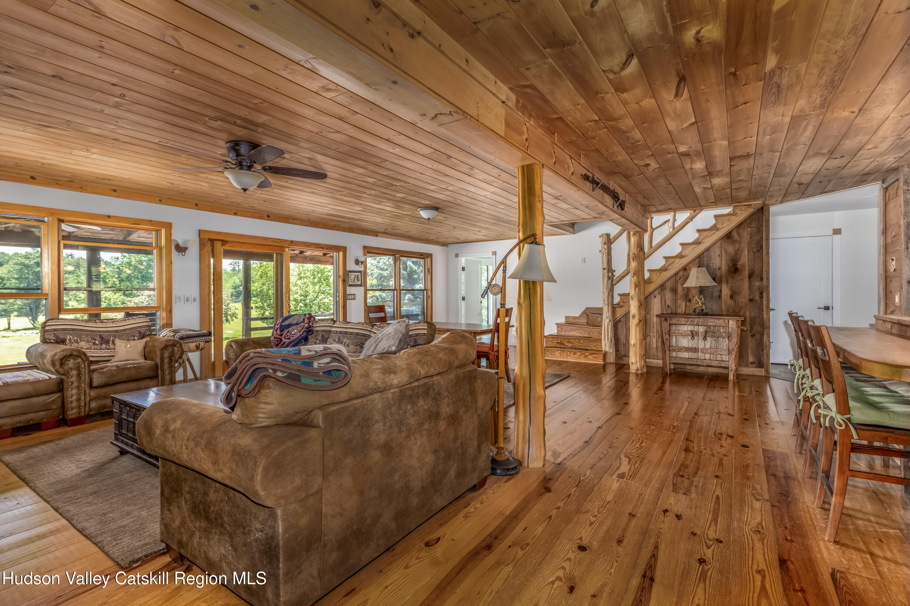 688 Bruce Porn Road Gilboa, NY 12167 - Photo 49 of 104 a living room with lots of furniture and wooden floor