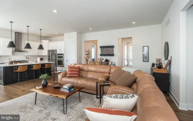 a bathroom with a toilet mirror and vanity