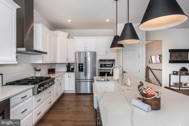 a view of a livingroom with furniture and a potted plant
