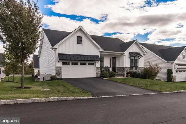 a view of a livingroom with furniture and hardwood floor