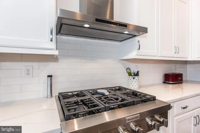 a front view of a house with a street